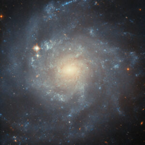 Hubble Focuses on Star-Forming Spiral Galaxy