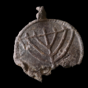 Rare 1,300-year-old medallion decorated with menorahs found near Jerusalem’s Temple Mount
