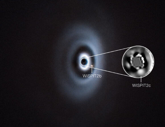 Two Protoplanets Emerge from Dusty Disk around Nearby Young Star