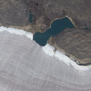 Mini lake meets snowy rim of Canada’s oldest ice mass — Earth from space