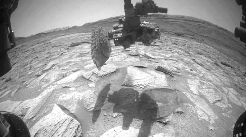 Watch NASA’s Curiosity rover ‘struggle’ to remove a rock that got stuck on its robotic arm for nearly a week