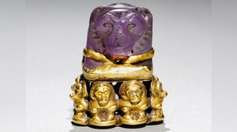 Lion’s head pendant: An ancient Egyptian board game piece that was later repurposed into a magical religious object with baboons