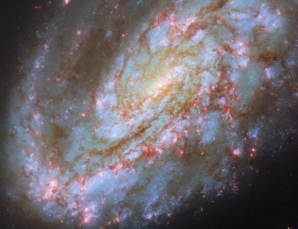 Hubble Spots Spiral Galaxy Warped by Cosmic Forces