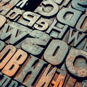 Does written language speed up or slow down cultural change?